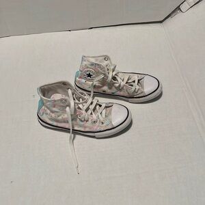 Converse unicorn high top tennis shoe.